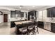 Beautiful kitchen with stainless steel appliances, an island and granite countertops at 20709 W Delaney Dr, Buckeye, AZ 85396