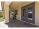 Covered patio with an outdoor grill, ample space, and double doors leading indoors at 20709 W Delaney Dr, Buckeye, AZ 85396