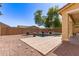 Inviting pool area with brick pavers and lush landscaping provides a relaxing outdoor retreat and focal point for the home at 20709 W Delaney Dr, Buckeye, AZ 85396