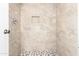 Remodeled bathroom with neutral stone tiled shower, a niche, and stylish floor at 2146 W Isabella Ave # 131, Mesa, AZ 85202