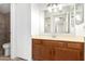 Bathroom features a wood vanity with a light countertop and a mirror at 2146 W Isabella Ave # 131, Mesa, AZ 85202