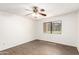 This bright bedroom features wood flooring and a window with a view at 2146 W Isabella Ave # 131, Mesa, AZ 85202