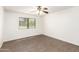 Bedroom with wood floors, ceiling fan, and bright natural light from the window at 2146 W Isabella Ave # 131, Mesa, AZ 85202