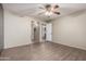 Bright bedroom featuring luxury vinyl flooring and hallway and kitchen access at 2146 W Isabella Ave # 131, Mesa, AZ 85202