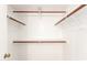 Walk-in closet equipped with multiple shelves and bars for ample storage at 2146 W Isabella Ave # 131, Mesa, AZ 85202