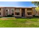 Exterior view of condo building with well-maintained lawn and stairs leading to units at 2146 W Isabella Ave # 131, Mesa, AZ 85202