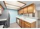 This is an efficient kitchen featuring stainless steel appliances and lots of wooden cabinets at 2146 W Isabella Ave # 131, Mesa, AZ 85202