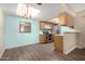 Open floor plan to the kitchen features stainless steel appliances at 2146 W Isabella Ave # 131, Mesa, AZ 85202