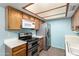 Kitchen with stainless steel appliances and bright lighting at 2146 W Isabella Ave # 131, Mesa, AZ 85202