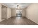 Bright living room with wood-look flooring and sliding glass door to balcony at 2146 W Isabella Ave # 131, Mesa, AZ 85202