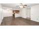 Bright living room showing the kitchen and entry with beautiful wood-style flooring at 2146 W Isabella Ave # 131, Mesa, AZ 85202