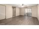 Bright living room with wood-look flooring and access to the balcony at 2146 W Isabella Ave # 131, Mesa, AZ 85202