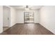 Bright living room featuring wood floors and a sliding door to the outdoor space at 2146 W Isabella Ave # 131, Mesa, AZ 85202