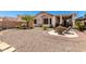 Well-maintained backyard with gravel landscaping and outdoor seating, perfect for relaxation and entertainment at 21563 N Greenway Rd, Maricopa, AZ 85138