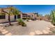 Desert-style backyard with gravel, stone and mature plants creating a beautiful, low-maintenance oasis at 21563 N Greenway Rd, Maricopa, AZ 85138