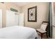 Cozy bedroom with a comfortable chair, soft lighting, and a relaxing atmosphere at 21563 N Greenway Rd, Maricopa, AZ 85138