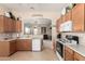 Efficient kitchen with bright natural light and open to the living room at 21563 N Greenway Rd, Maricopa, AZ 85138