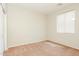 A cozy bedroom featuring a window for natural light and a closet at 2401 W Ellis St, Phoenix, AZ 85041