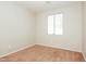 A bright bedroom featuring a large window offering ample natural light at 2401 W Ellis St, Phoenix, AZ 85041