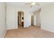 Bedroom featuring plush carpet, an ensuite bathroom, and a walk-in closet at 2401 W Ellis St, Phoenix, AZ 85041