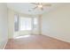 A bright bedroom with large windows providing natural light and a ceiling fan for added comfort at 2401 W Ellis St, Phoenix, AZ 85041