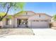 Charming single-story home with a two-car garage and desert landscaping under a clear, sunny sky at 2401 W Ellis St, Phoenix, AZ 85041