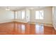 Inviting living room with natural light, hardwood floors, and tile accents at the entrance at 2401 W Ellis St, Phoenix, AZ 85041