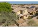 Aerial view of the backyard with a small balcony, desert landscaping and block fence at 2406 N 142Nd Ave, Goodyear, AZ 85395