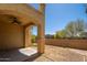 Covered patio in backyard with ceiling fan and direct access to the home at 2406 N 142Nd Ave, Goodyear, AZ 85395