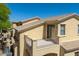 Exterior view showing a private balcony with desert landscaping below and stucco exterior at 2406 N 142Nd Ave, Goodyear, AZ 85395