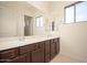 Bathroom with dual sinks and an over-sized vanity mirror at 2406 N 142Nd Ave, Goodyear, AZ 85395