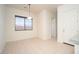 Bright dining area with tile flooring, natural light from a window, and a modern light fixture at 2406 N 142Nd Ave, Goodyear, AZ 85395