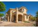 Exterior elevation showcasing the stucco and the front yard landscaping at 2406 N 142Nd Ave, Goodyear, AZ 85395