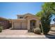 Charming two-story home with a three-car garage and a well-manicured front yard in a sunny neighborhood at 2406 N 142Nd Ave, Goodyear, AZ 85395