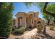 Charming single-Gathering home featuring a landscaped front yard, a two-car garage, and a welcoming entrance at 2406 N 142Nd Ave, Goodyear, AZ 85395