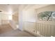 Bright upstairs hallway with railing and view, leading to the bedrooms and living areas in the home at 2406 N 142Nd Ave, Goodyear, AZ 85395