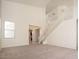 Spacious living room with neutral carpet, soaring ceilings, and ample natural light, flowing into dining area at 2406 N 142Nd Ave, Goodyear, AZ 85395