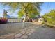 Charming backyard featuring decorative gravel, desert landscaping, and a unique stone pathway to the main house at 2534 N 10Th St, Phoenix, AZ 85006