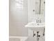 Cozy bathroom with a pedestal sink, mirrored medicine cabinet and ceramic tile in a vintage style at 2534 N 10Th St, Phoenix, AZ 85006