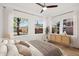 Sunlit bedroom features large windows, neutral décor, and a ceiling fan at 2534 N 10Th St, Phoenix, AZ 85006