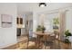Charming dining room adjacent to the kitchen, featuring natural light and hardwood floors at 2534 N 10Th St, Phoenix, AZ 85006