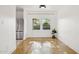Charming dining area features hardwood floors, bright natural light, and stainless steel refrigerator at 2534 N 10Th St, Phoenix, AZ 85006