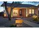 Quaint brick home with a cozy covered porch, xeriscaping, and illuminated address marker offers curb appeal at 2534 N 10Th St, Phoenix, AZ 85006