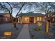 Charming brick home with desert landscaping, walkway, and a cozy front porch with bench seating at 2534 N 10Th St, Phoenix, AZ 85006