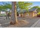 Charming brick home with covered front porch, bench seating, and desert landscaping provides curb appeal at 2534 N 10Th St, Phoenix, AZ 85006