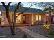 Brick home featuring a cozy front porch with bench seating, xeriscaping, and walkway with exterior lighting at 2534 N 10Th St, Phoenix, AZ 85006