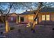Inviting brick home boasts a cozy front porch with seating, xeriscaping, and walkway with lighting at 2534 N 10Th St, Phoenix, AZ 85006