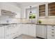Charming kitchen with white cabinetry, subway tile backsplash, and vintage-style gas range at 2534 N 10Th St, Phoenix, AZ 85006