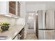 Stylish kitchen featuring stainless steel appliances, including dishwasher and large refrigerator at 2534 N 10Th St, Phoenix, AZ 85006