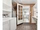 Utility Room with laundry machines and ample storage, with access to the kitchen at 2534 N 10Th St, Phoenix, AZ 85006
